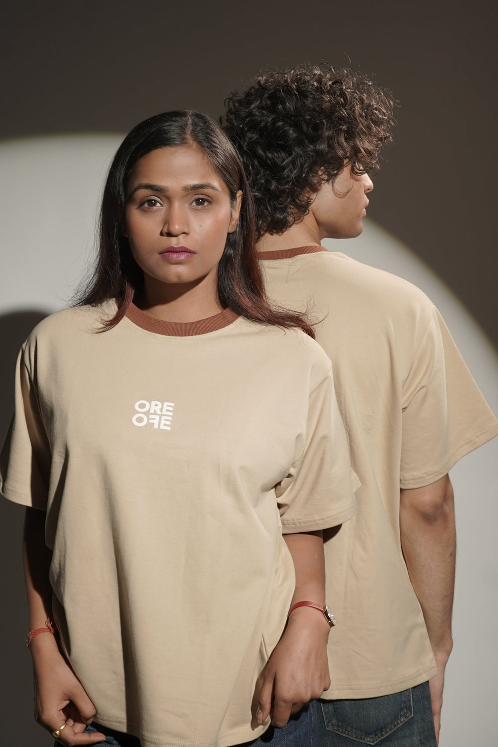 Male and female Model wearing Beige basic Oversized t-shirt, with front and back facing.