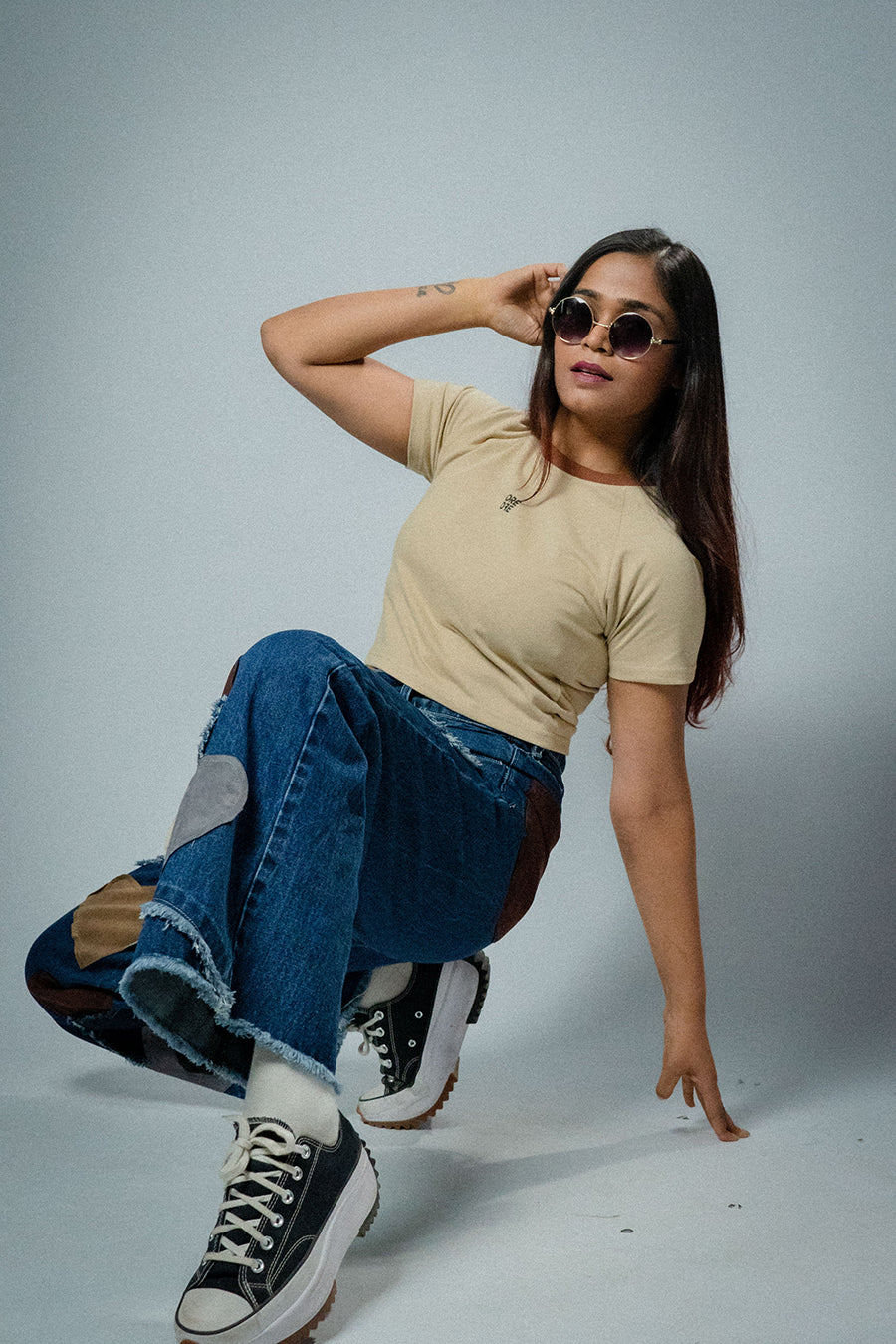Female model wearing Beige basic crop top