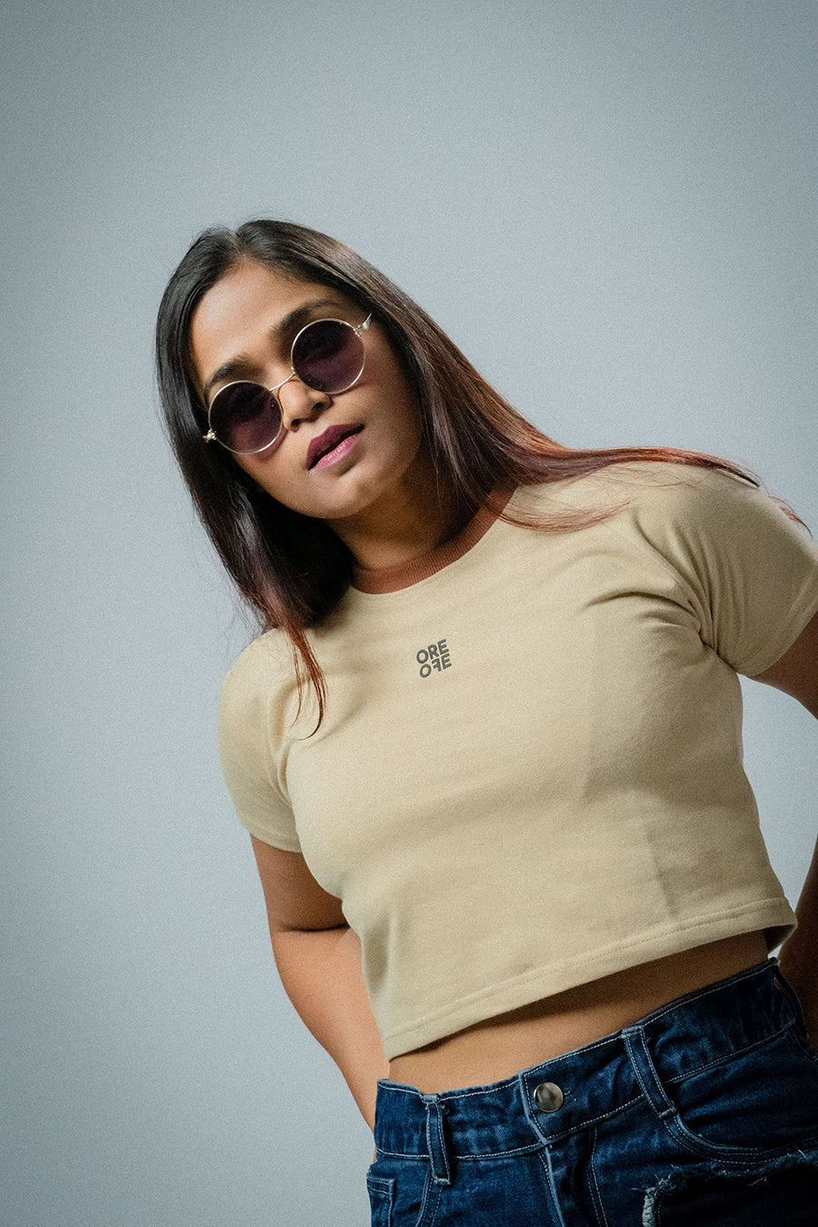 Female model wearing Beige basic crop top