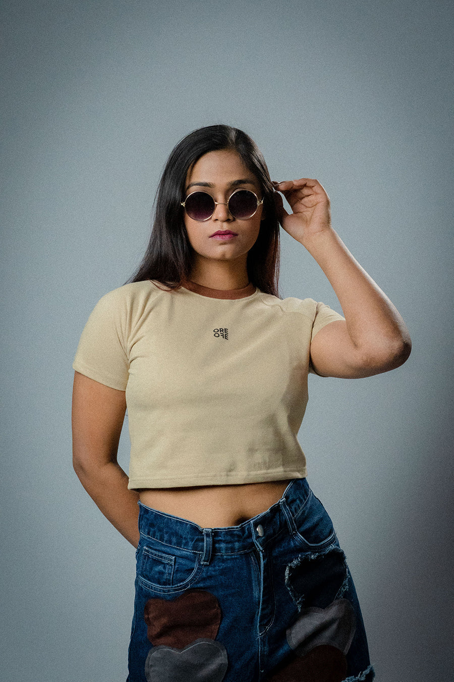Female model wearing Beige basic crop top