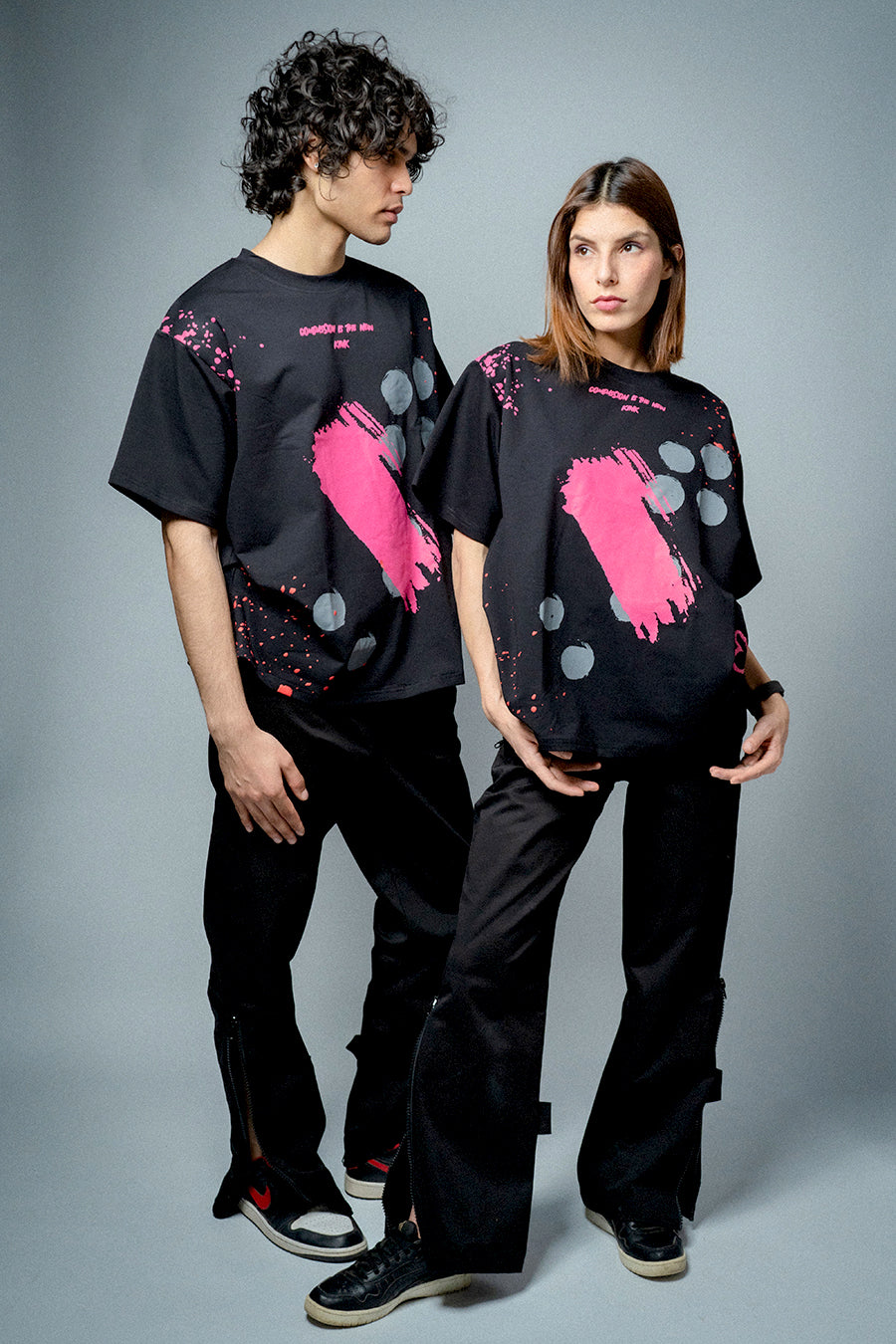 Male and female model wearing Compassion is the New Kink T-shirt 