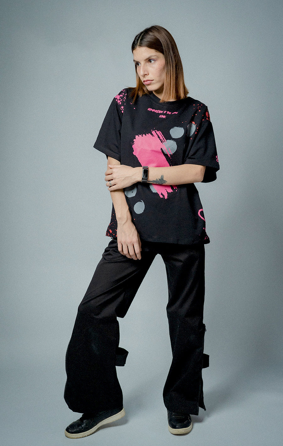 Female model wearing Compassion is the New Kink T-shirt 