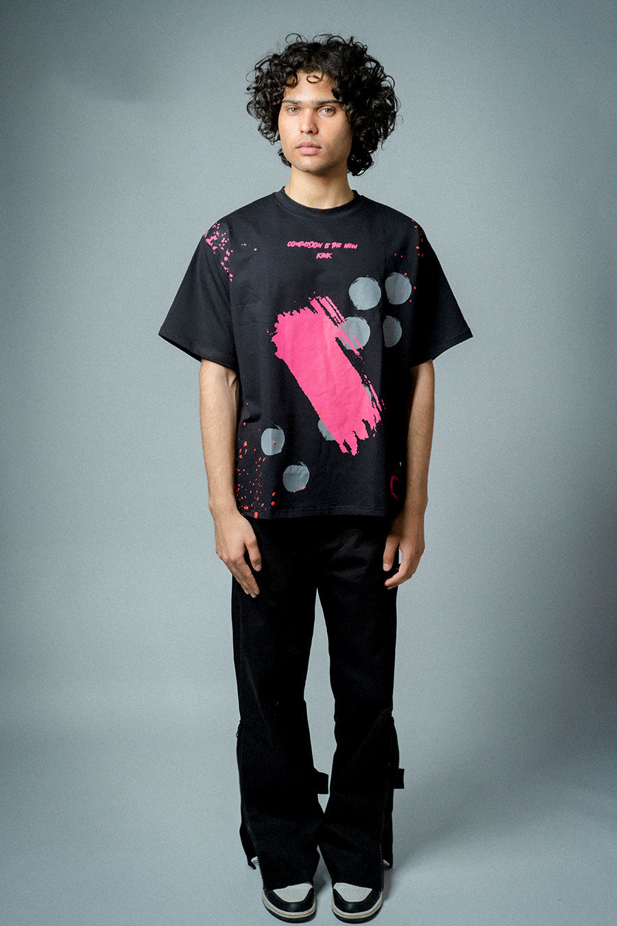 Male model wearing Compassion is the New Kink T-shirt 