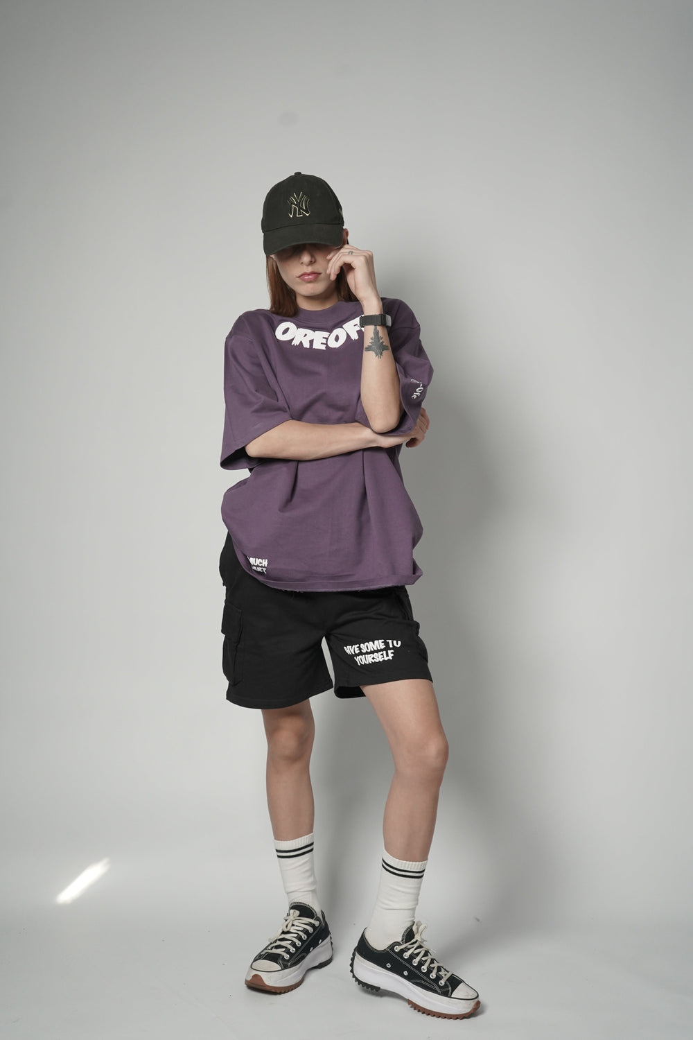 A model wearing Self Love Co-ord Set and a cap