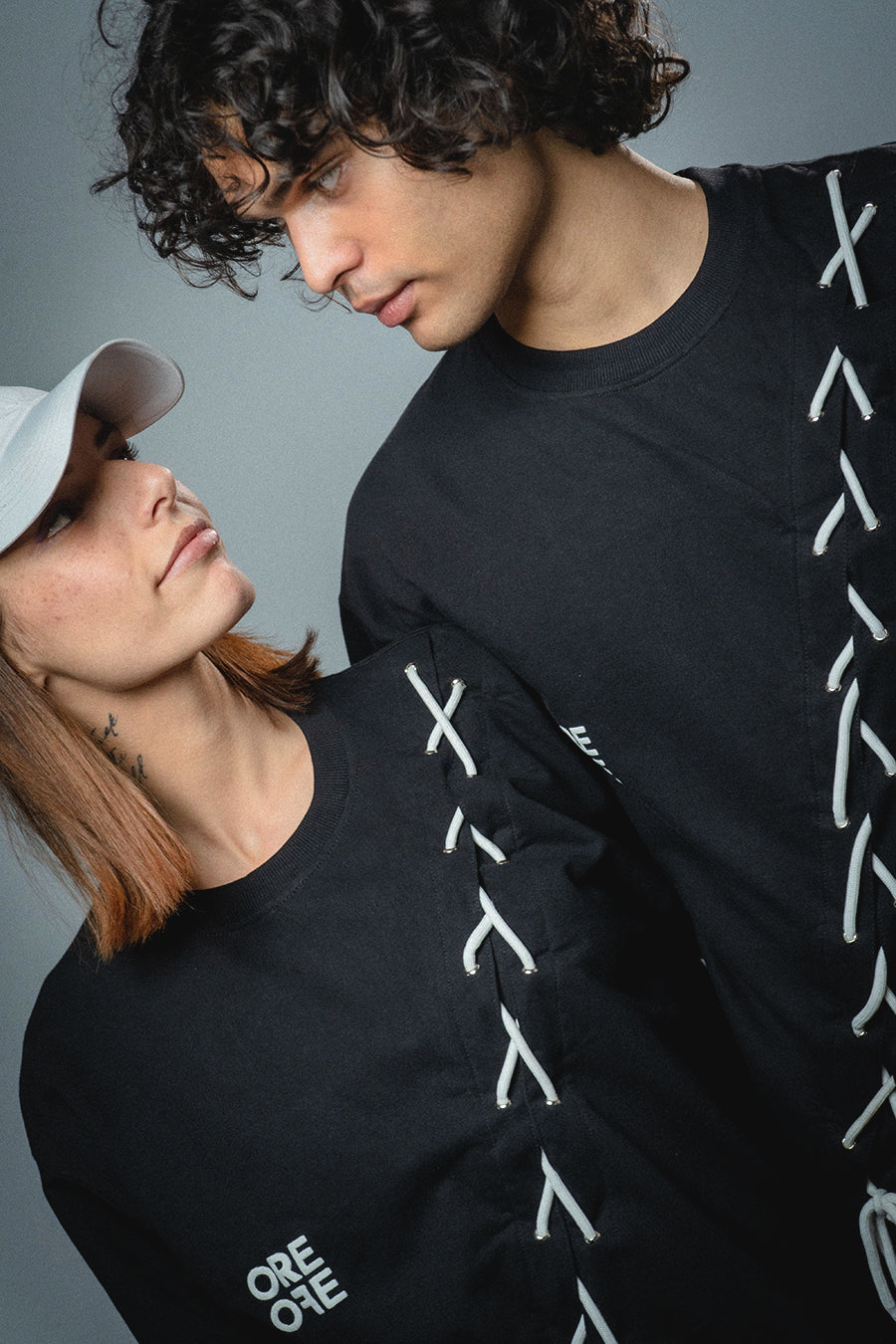 Male and female model wearing  full-length Korean oversized tee