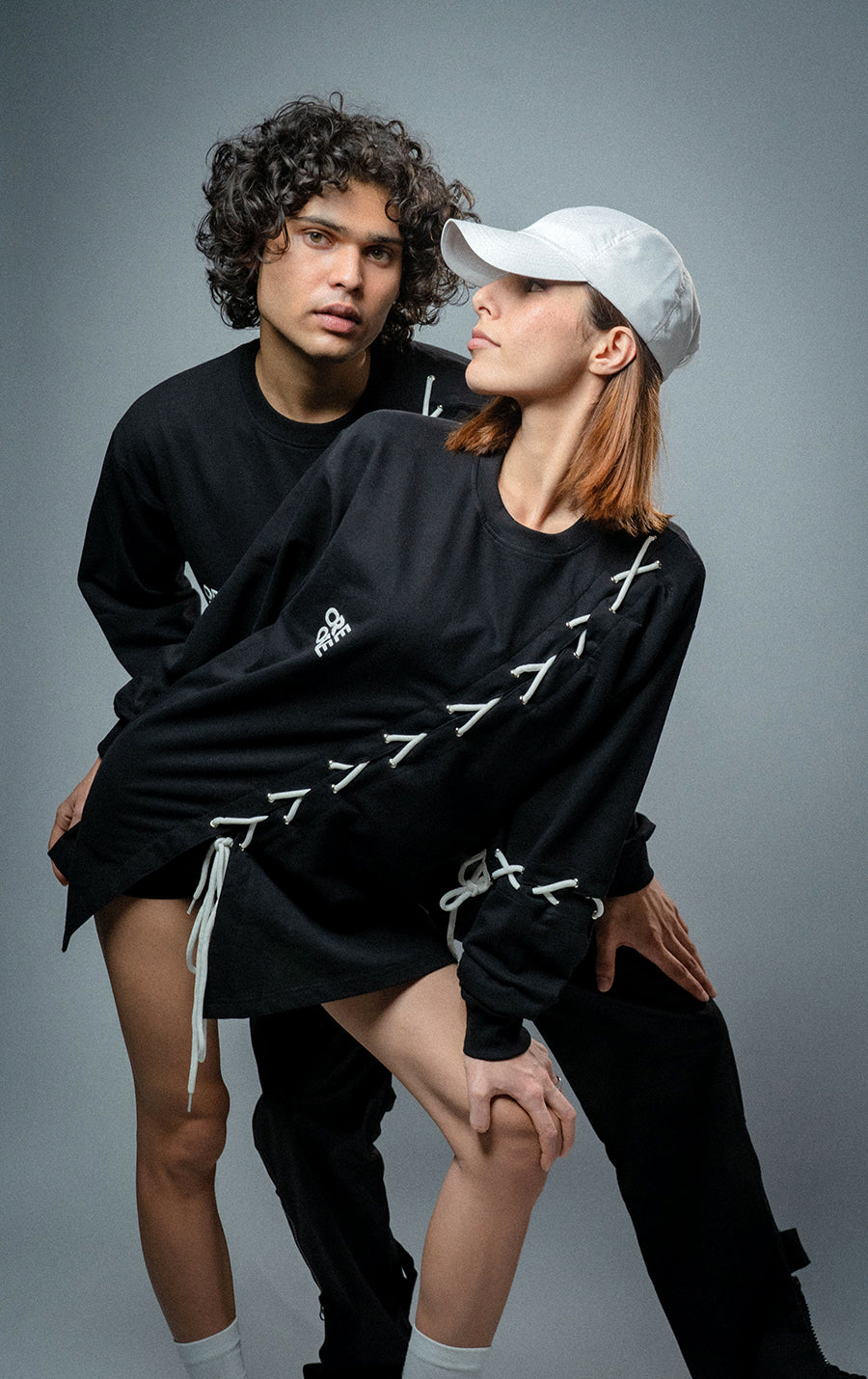 Male and female model wearing  full-length Korean oversized tee