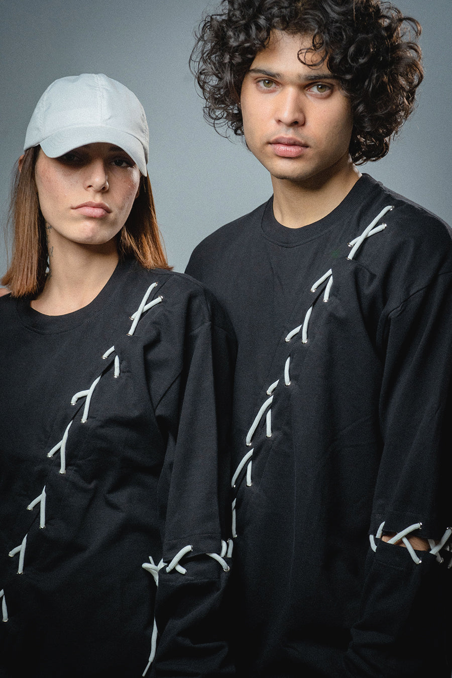 Male and female model wearing  full-length Korean oversized tee