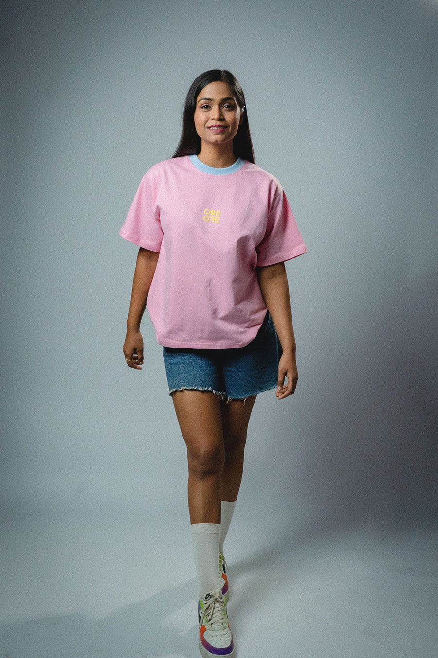 A girl wearing Ore Ofe Pink Oversized t-shirt