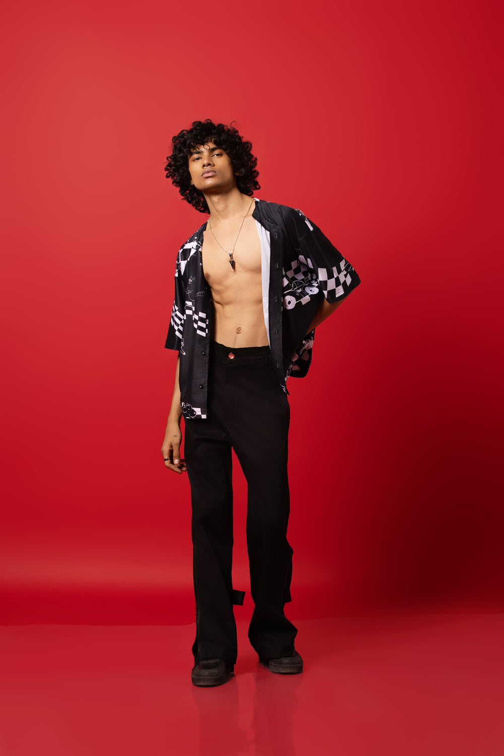 Model wearing an oversized shirt inspired by baseball jerseys, featuring a bold racing mania design print