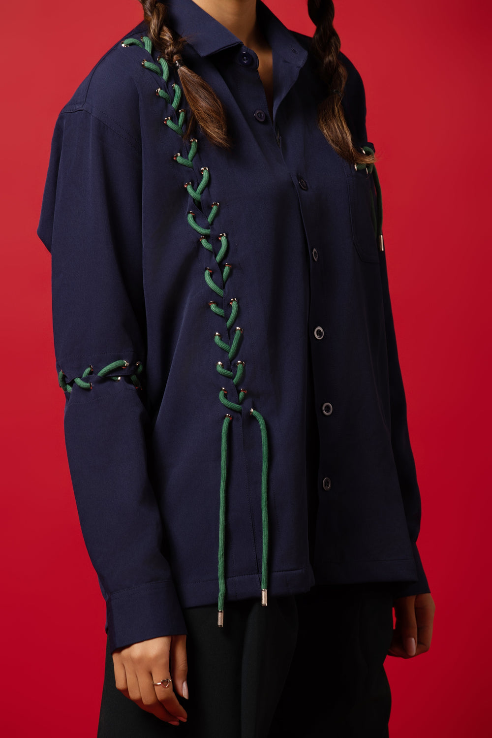 Model wearing a dropped shoulder shirt made from Banana Crepe fabric, blending tradition with modern style.