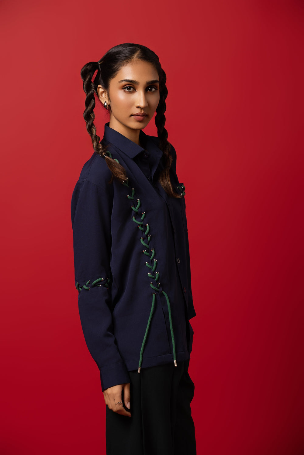Model wearing a dropped shoulder shirt made from Banana Crepe fabric, blending tradition with modern style.