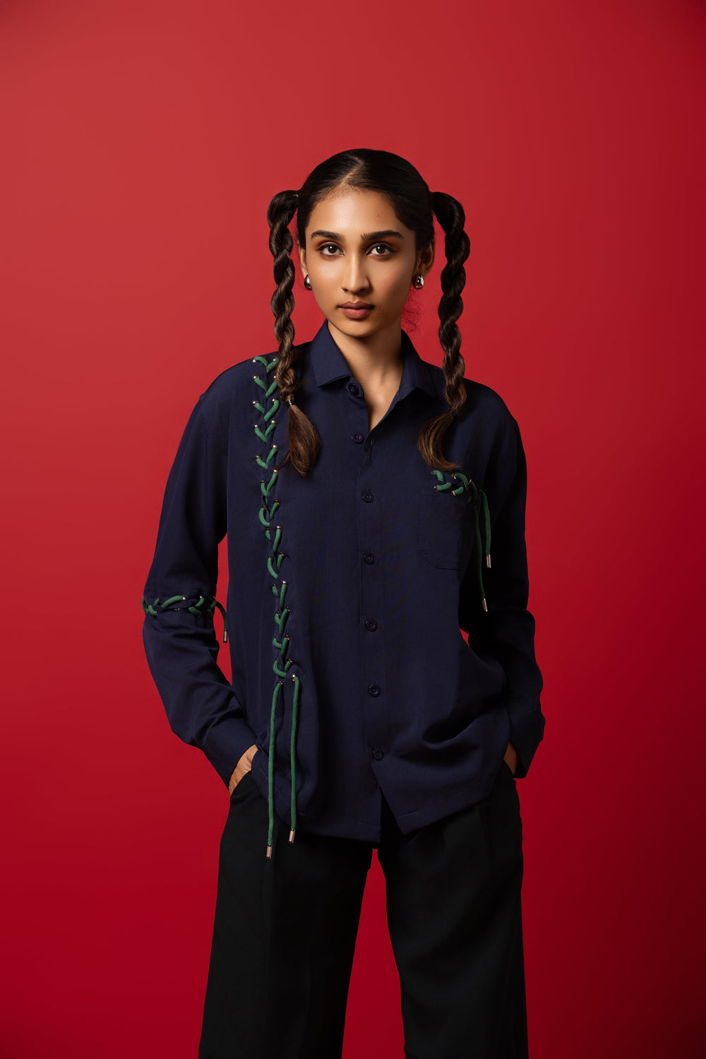 Model wearing a dropped shoulder shirt made from Banana Crepe fabric, blending tradition with modern style.