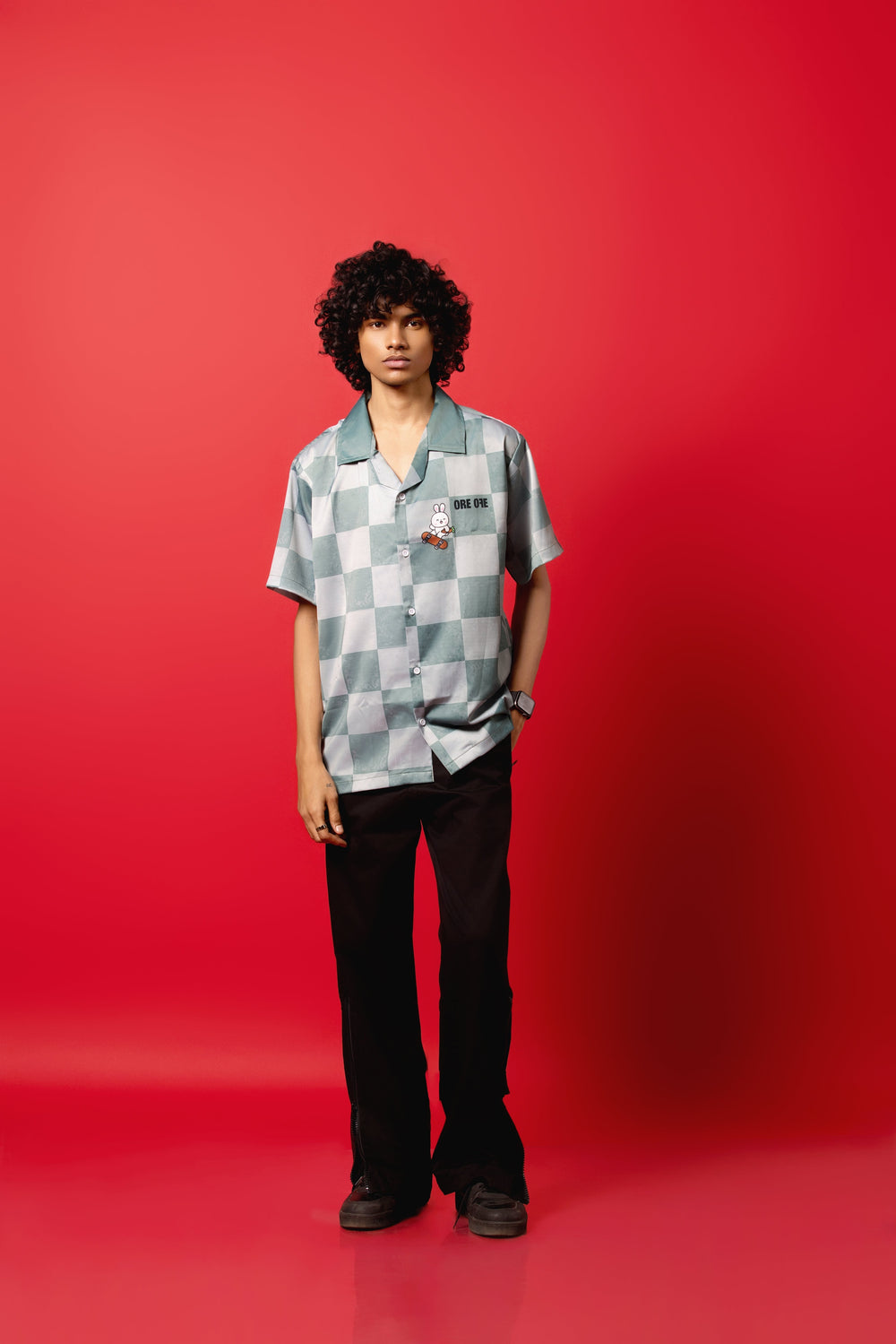 Model wearing the Skater Rabbit Button-Down Shirt made from Silk Satin, featuring a sublimation print