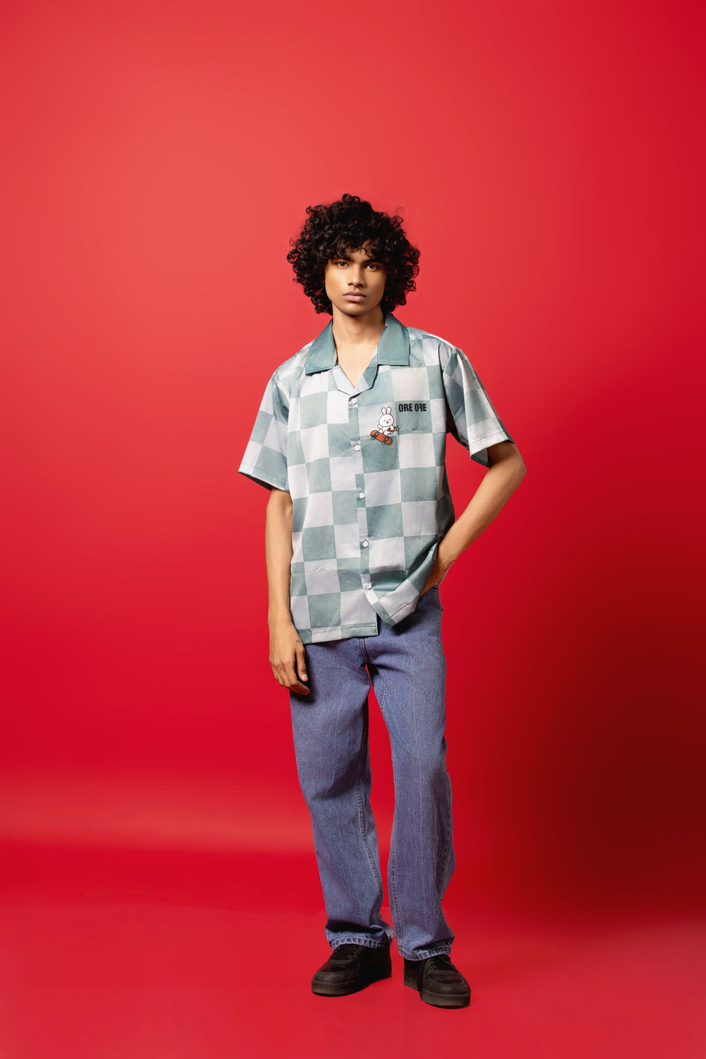 Model wearing the Skater Rabbit Button-Down Shirt made from Silk Satin, featuring a sublimation print.