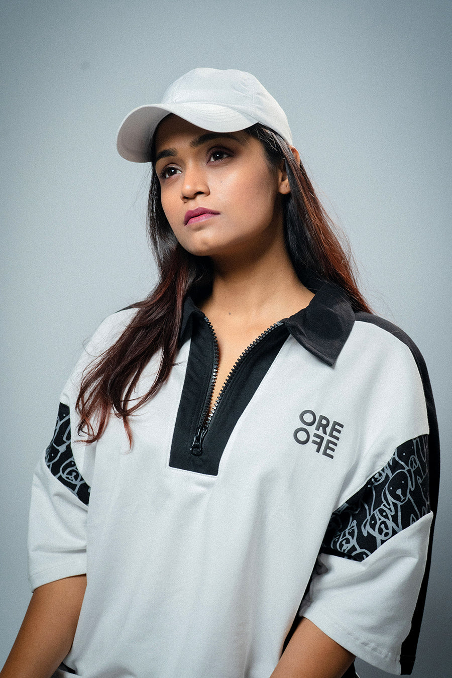 A girl wearing White & Black Oversized Polo