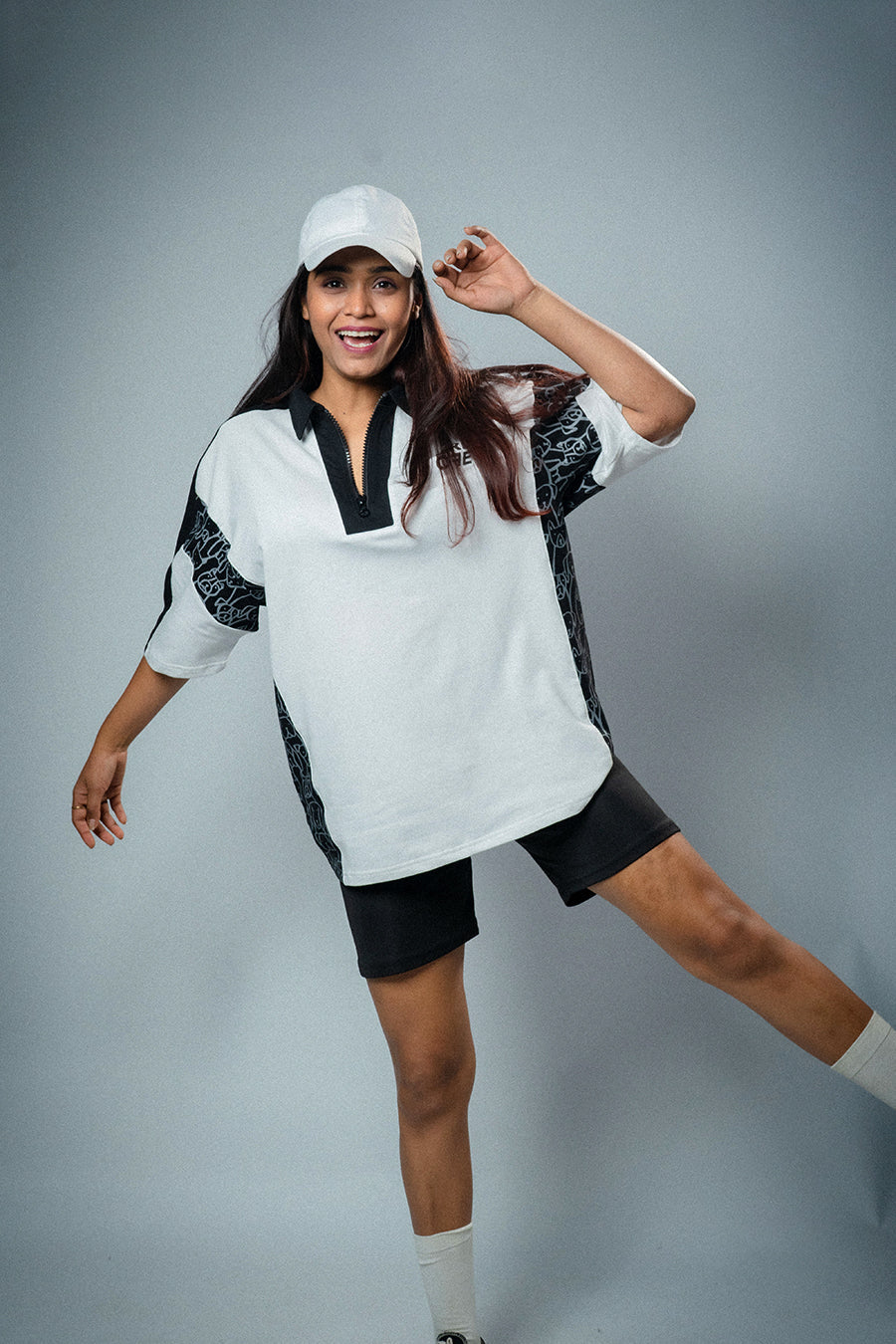 A girl wearing White & Black Oversized Polo