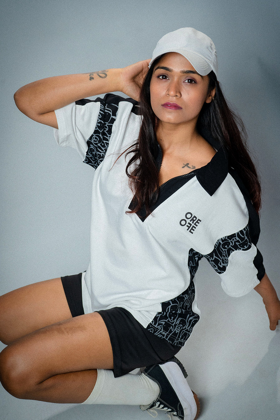 A girl wearing White & Black Oversized Polo
