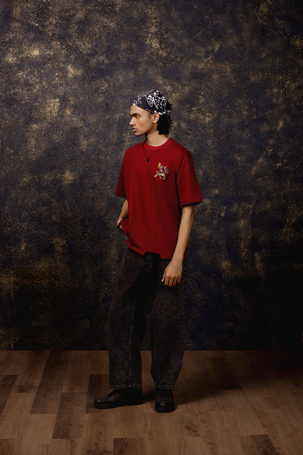 Model wearing Xolotl Oversized T-shirt with Aztec dog god design, 100% Terry Cotton, embroidery & screen printing