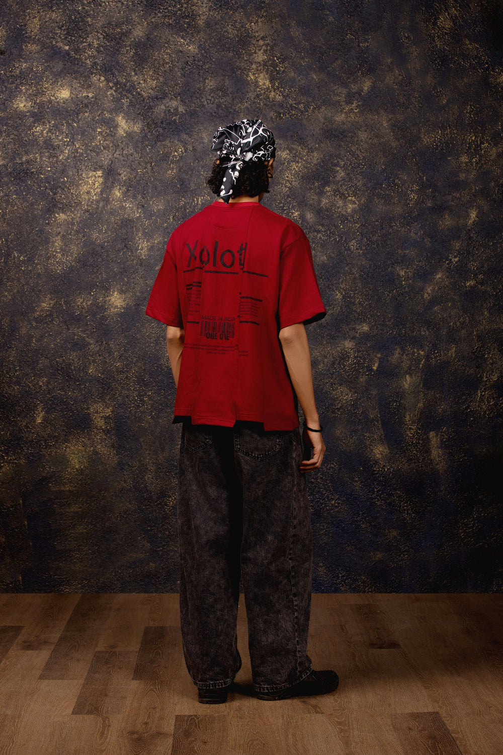 Model wearing Xolotl Oversized T-shirt with Aztec dog god design, 100% Terry Cotton, embroidery & screen printing. showing back print.