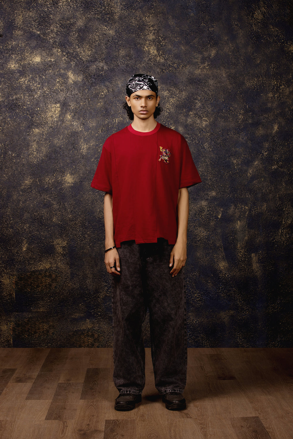 Model wearing Xolotl Oversized T-shirt with Aztec dog god design, 100% Terry Cotton, embroidery & screen printing